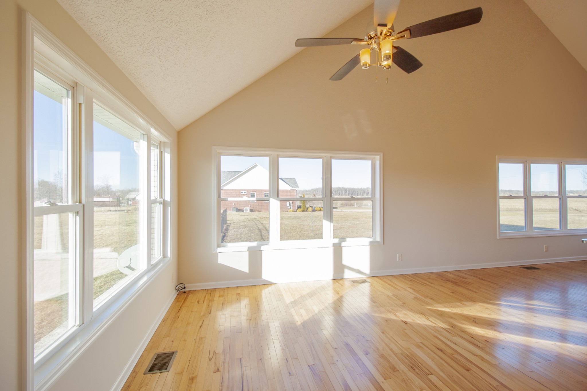 6875 Maple Springs Road Manchester, TN 37355 - Photo 24 of 36 a view of an empty room with a window and wooden floor