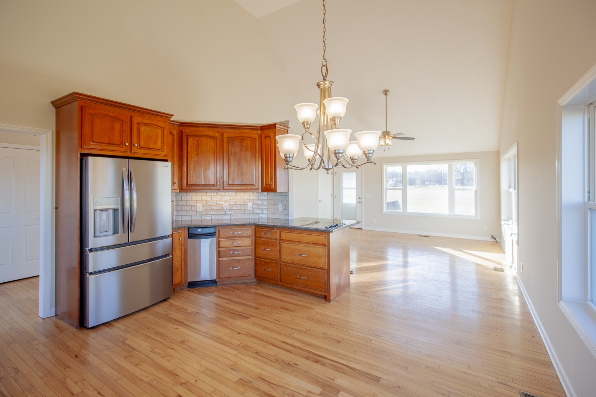6875 Maple Springs Road Manchester, TN 37355 - Photo 25 of 36 a kitchen with stainless steel appliances granite countertop a refrigerator a sink dishwasher a oven and wooden floor