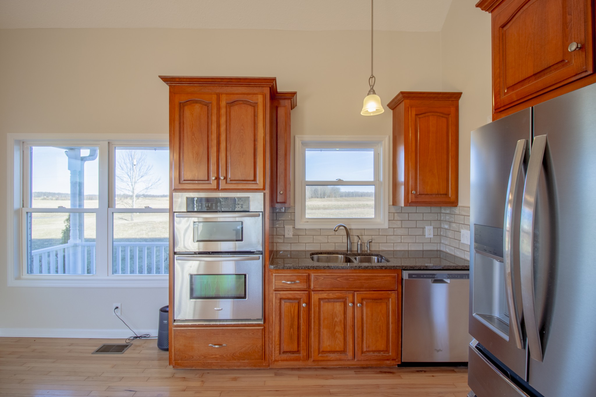 6875 Maple Springs Road Manchester, TN 37355 - Photo 27 of 36 a kitchen with stainless steel appliances granite countertop a refrigerator and a sink