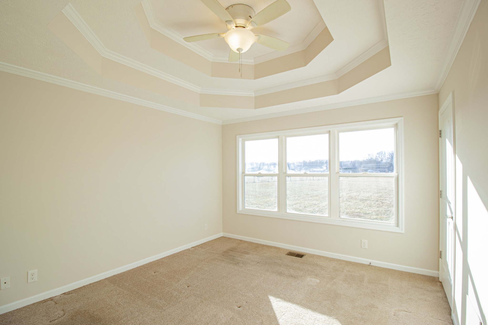 6875 Maple Springs Road Manchester, TN 37355 - Photo 29 of 36 an empty room with a window and a ceiling fan