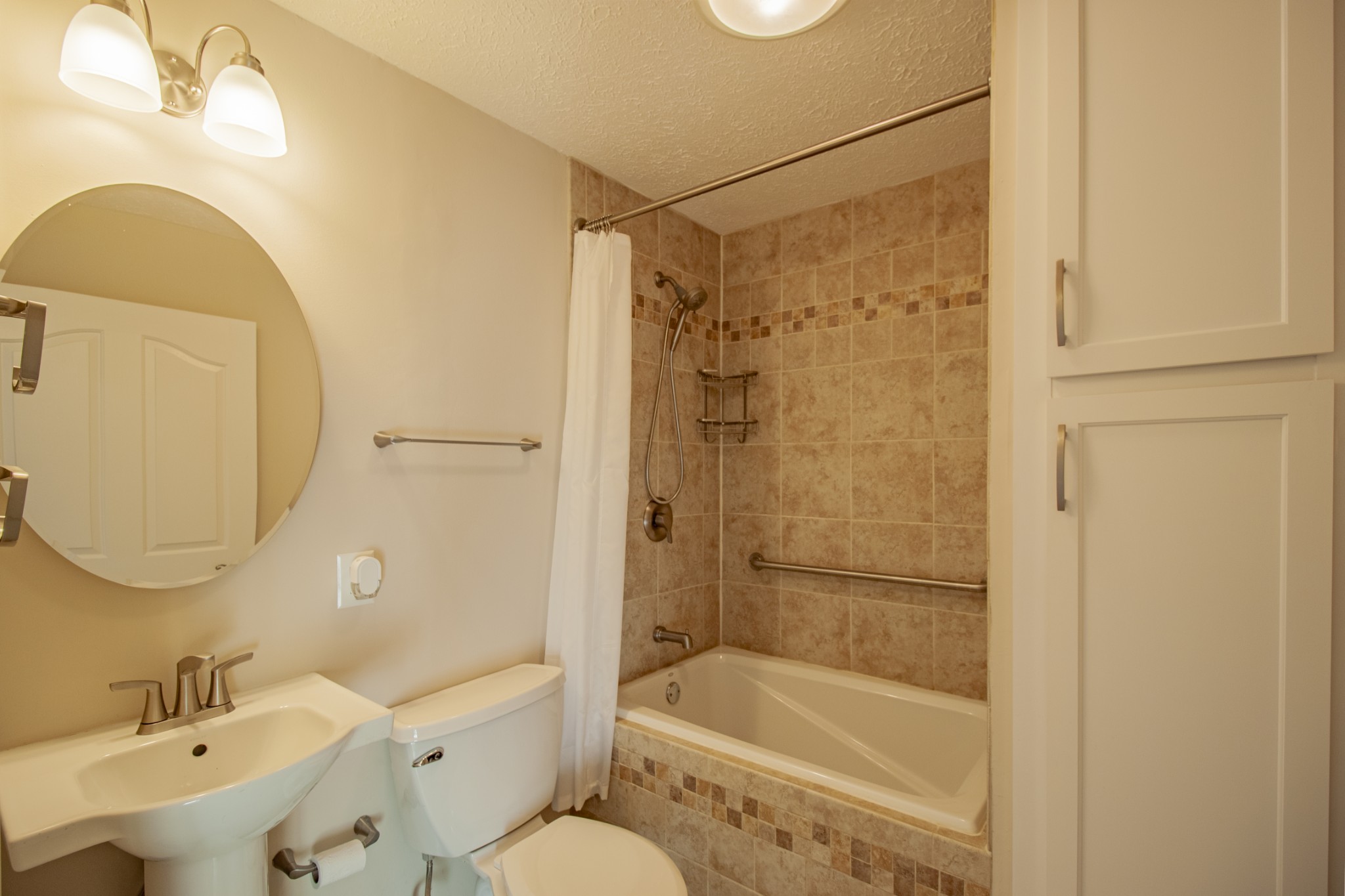 6875 Maple Springs Road Manchester, TN 37355 - Photo 33 of 36 a bathroom with a bathtub shower sink mirror and toilet