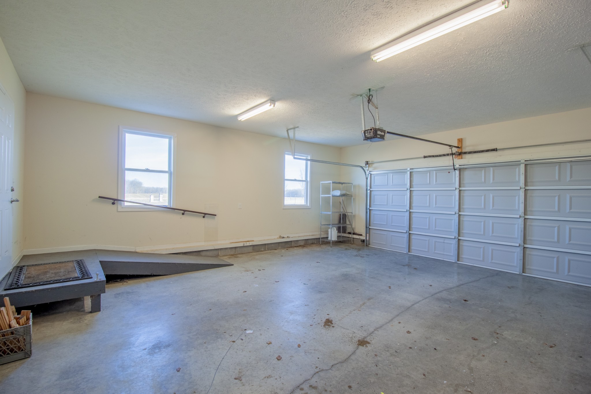 6875 Maple Springs Road Manchester, TN 37355 - Photo 36 of 36 an empty room with chandelier and windows