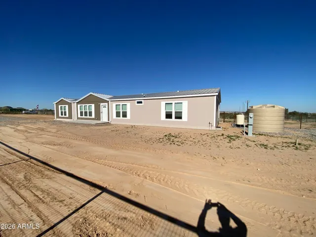 a view of a terrace with wooden floor and a flat screen tv