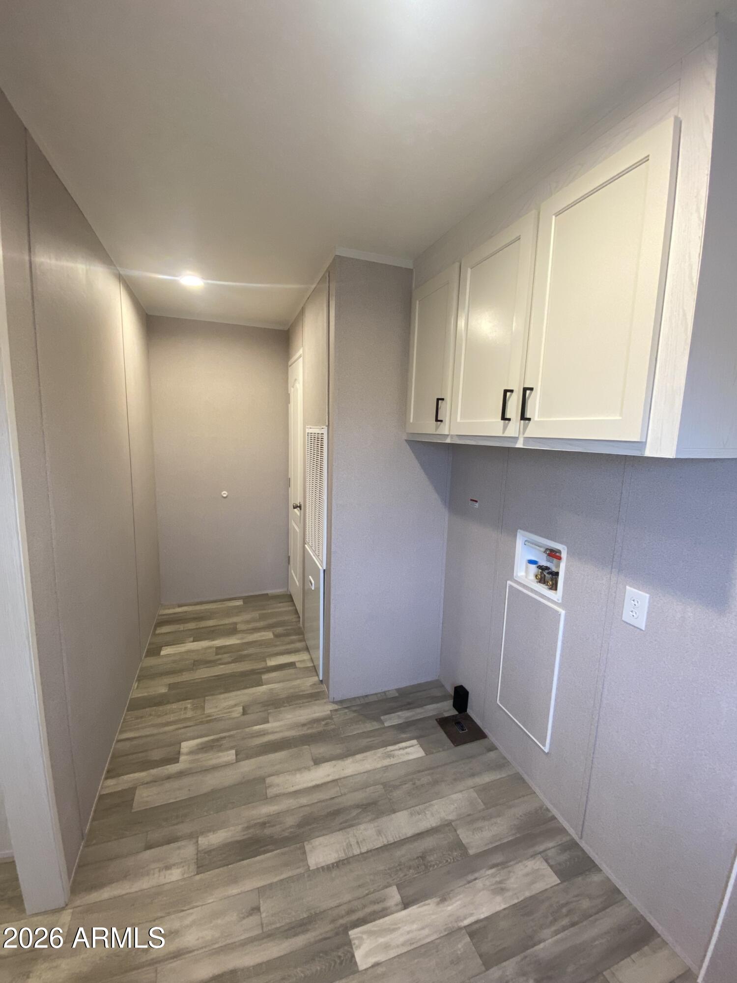 519 South Ortega Road Stanfield, AZ 85172 - Photo 13 of 29 a view of a livingroom with wooden floor