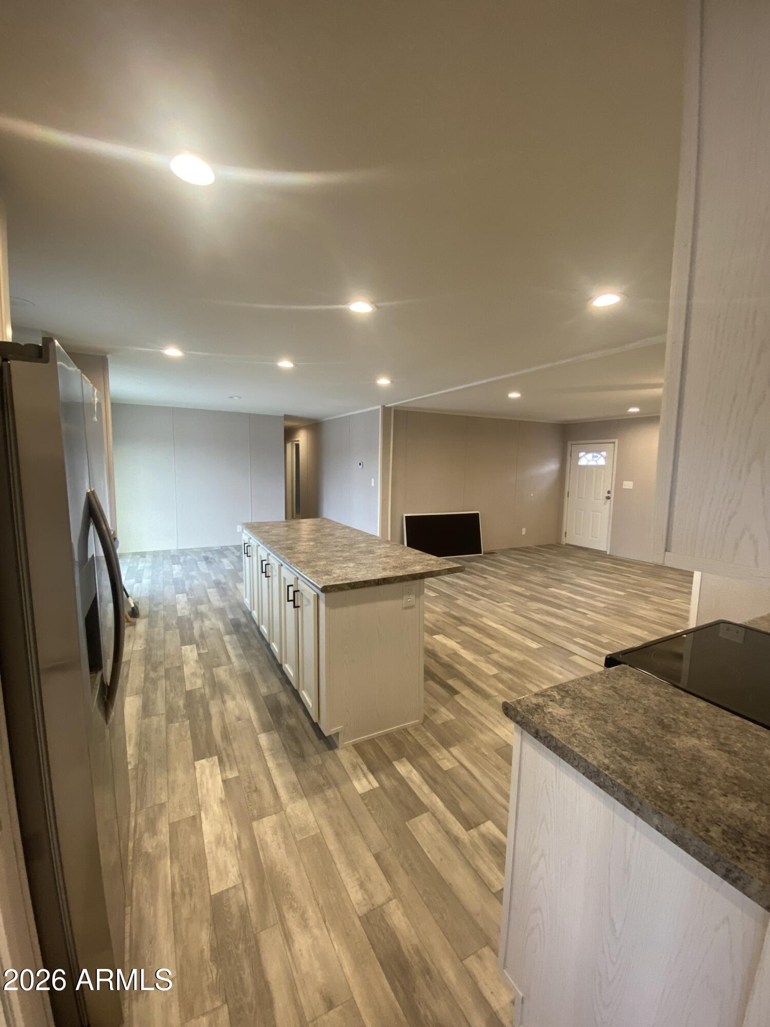 519 South Ortega Road Stanfield, AZ 85172 - Photo 14 of 29 a large room with kitchen view