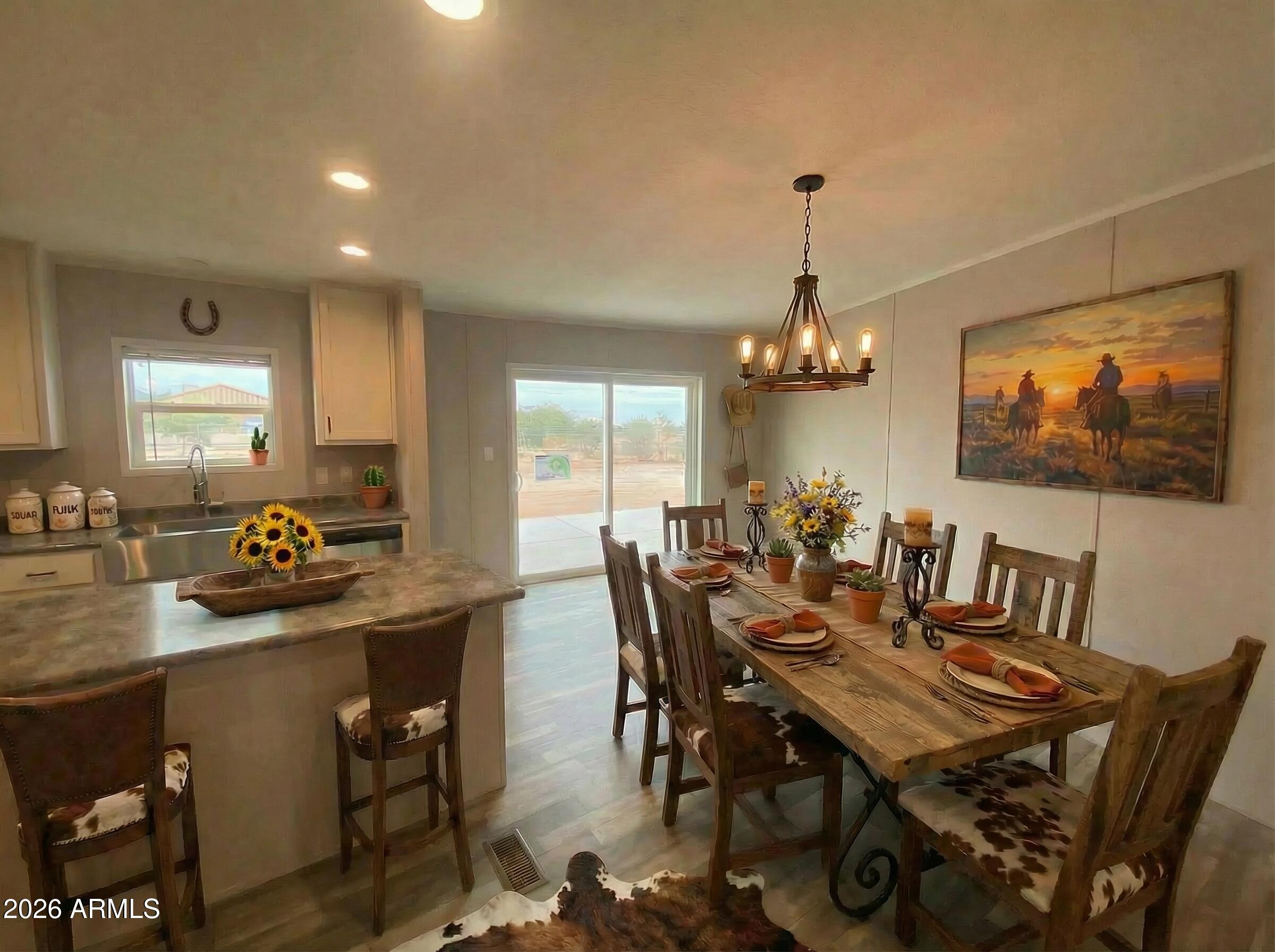 519 South Ortega Road Stanfield, AZ 85172 - Photo 15 of 27 a view of a dining room with furniture window and outside view
