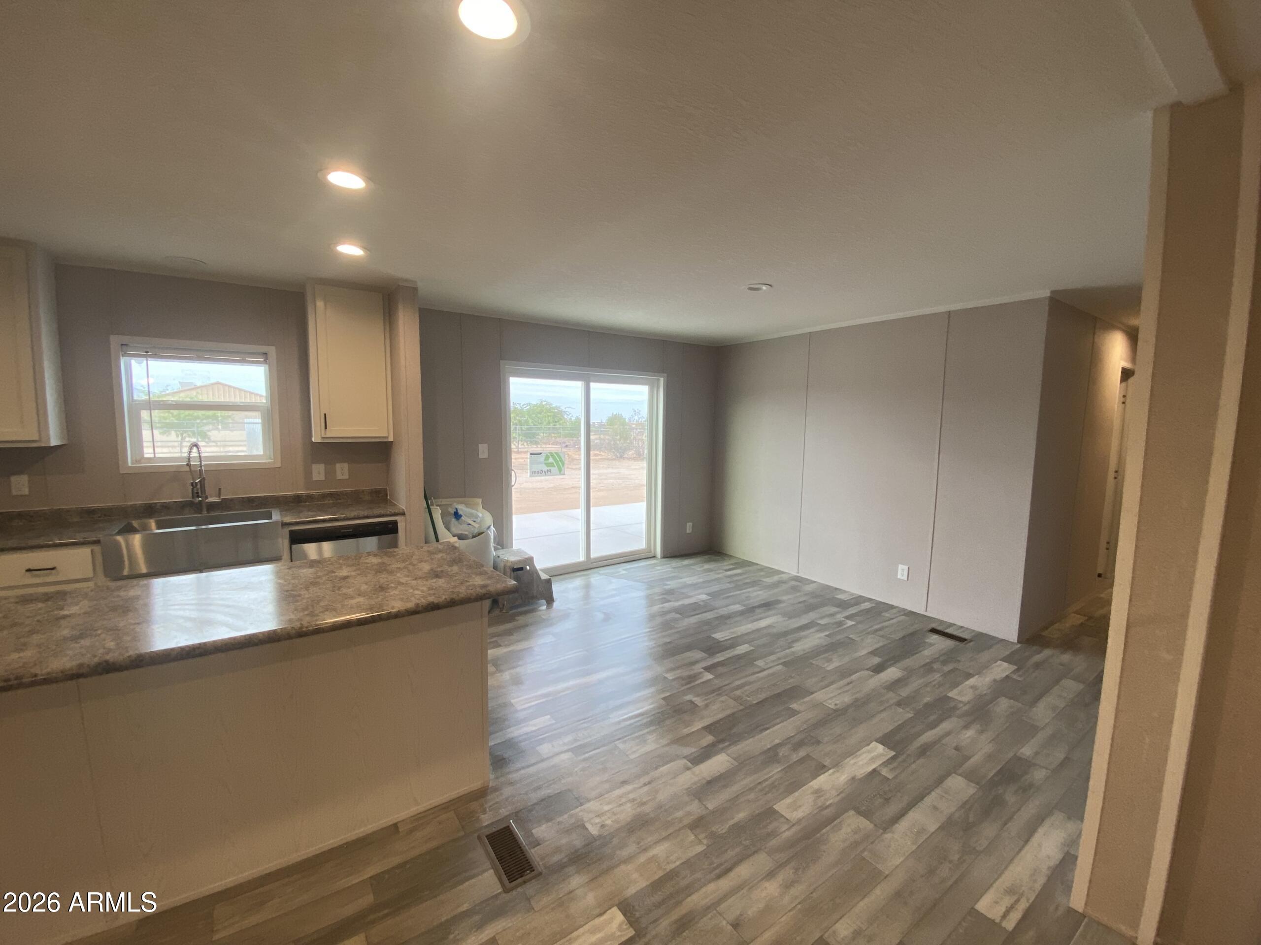 519 South Ortega Road Stanfield, AZ 85172 - Photo 18 of 29 a large kitchen with granite countertop a sink and a granite counter top