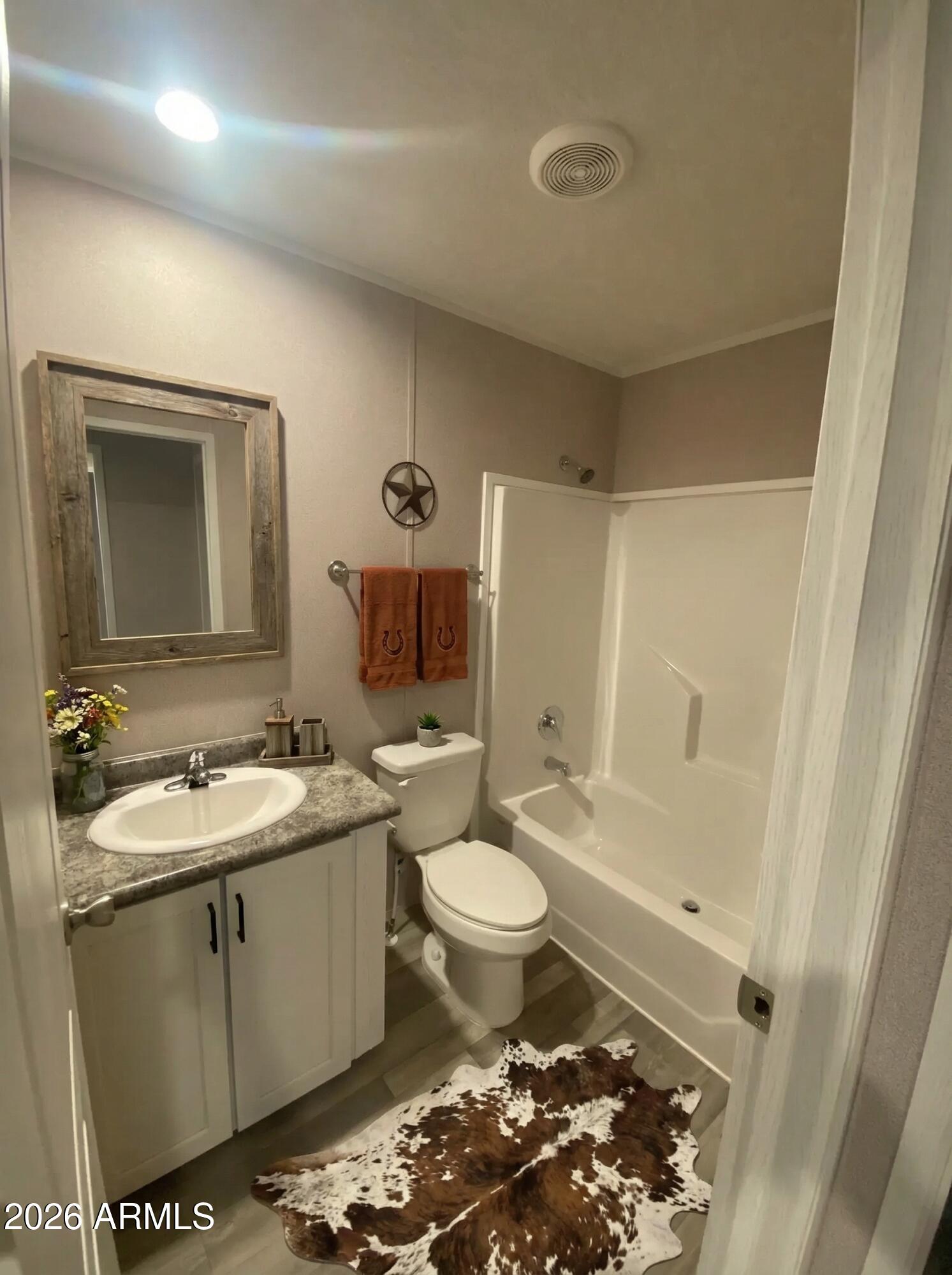 519 South Ortega Road Stanfield, AZ 85172 - Photo 22 of 27 a bathroom with a sink toilet and shower