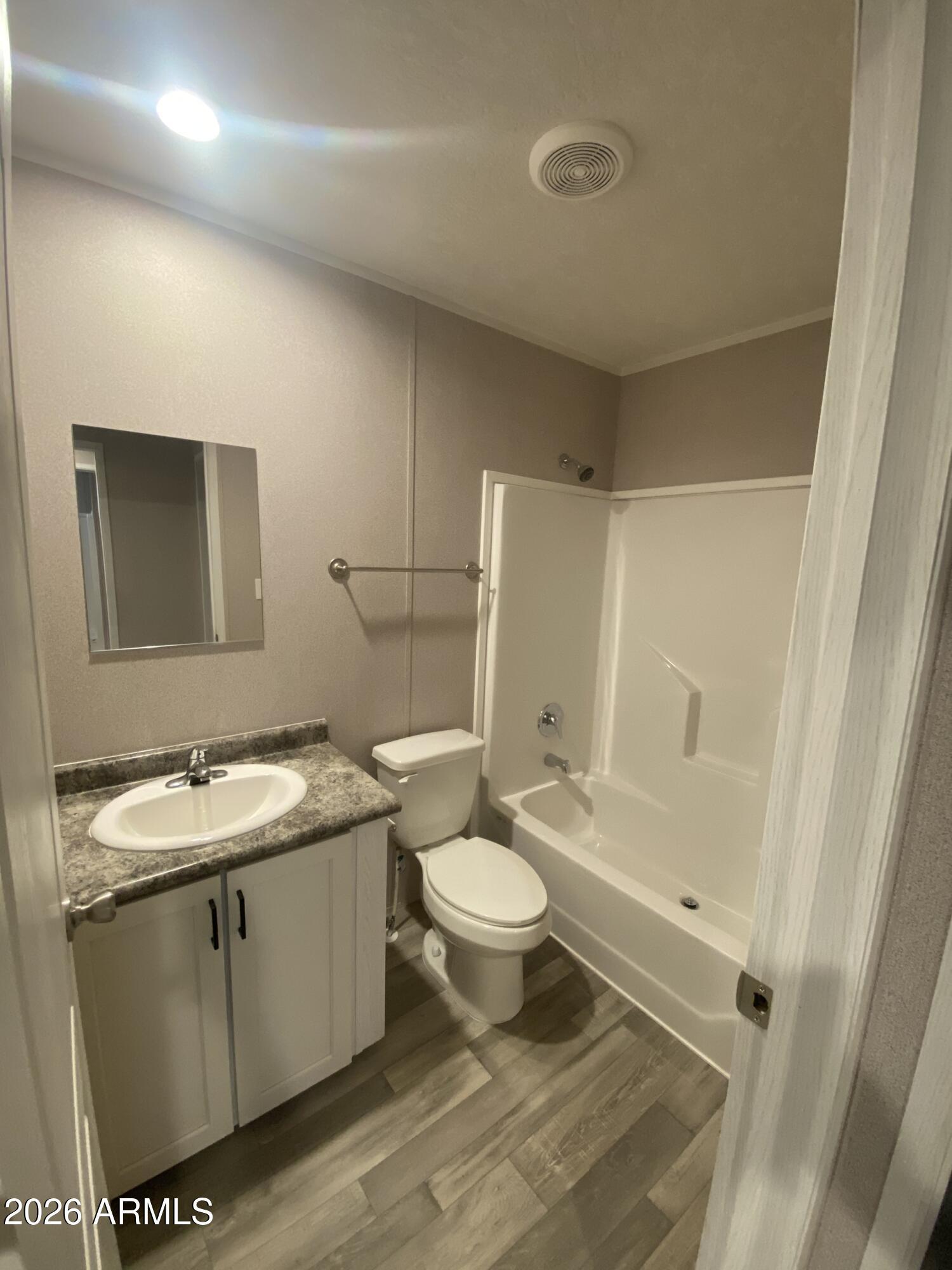 519 South Ortega Road Stanfield, AZ 85172 - Photo 24 of 29 a bathroom with a sink toilet and shower