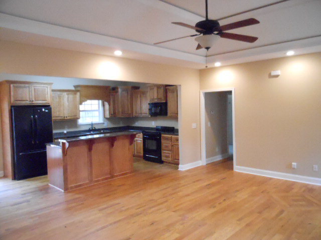 661 Altman Road Gray, GA 31032 - Photo 2 of 9 a large kitchen with granite countertop a refrigerator and a sink