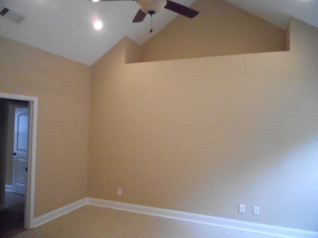 661 Altman Road Gray, GA 31032 - Photo 4 of 9 an empty room with a workbench