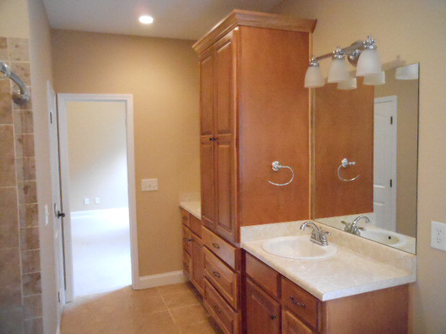 661 Altman Road Gray, GA 31032 - Photo 5 of 9 a bathroom with a double vanity sink mirror and shower