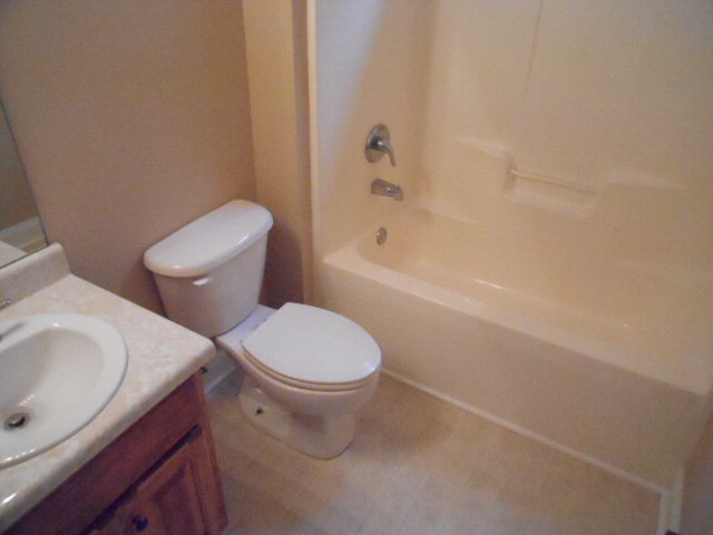 661 Altman Road Gray, GA 31032 - Photo 7 of 9 a white toilet sitting next to a bath tub