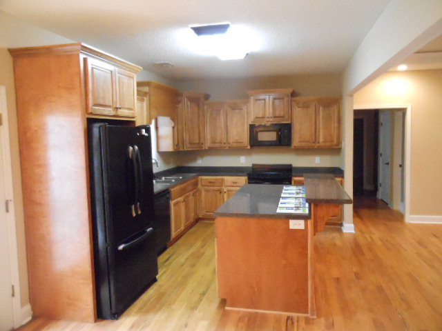 661 Altman Road Gray, GA 31032 - Photo 9 of 9 a kitchen with stainless steel appliances granite countertop a refrigerator and a stove top oven