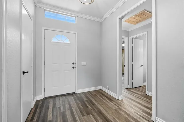 a view of a room with wooden floor and closet