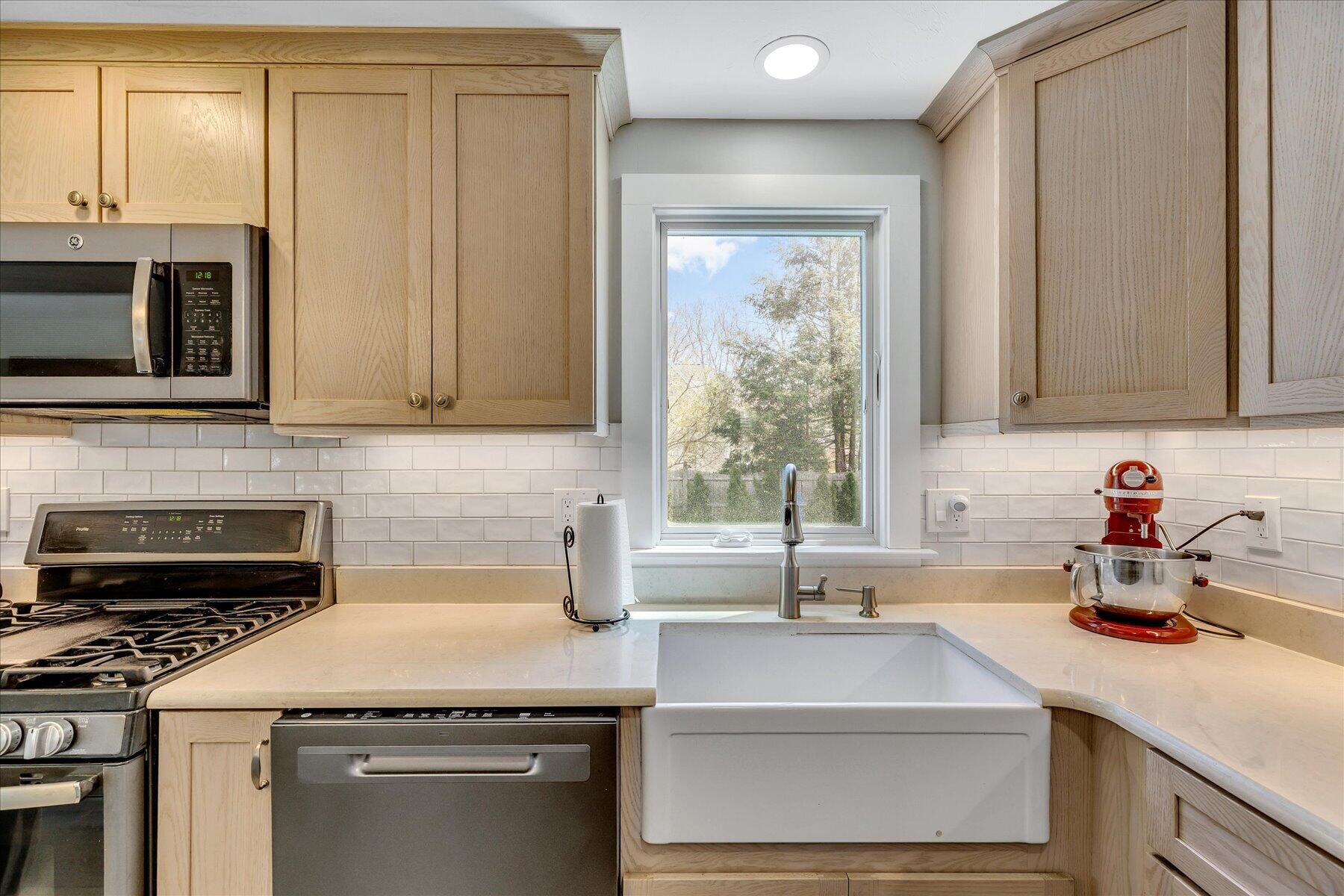 12 Drew Lane Mashpee, MA 02649 - Photo 17 of 49 a kitchen with granite countertop a sink stove and cabinets