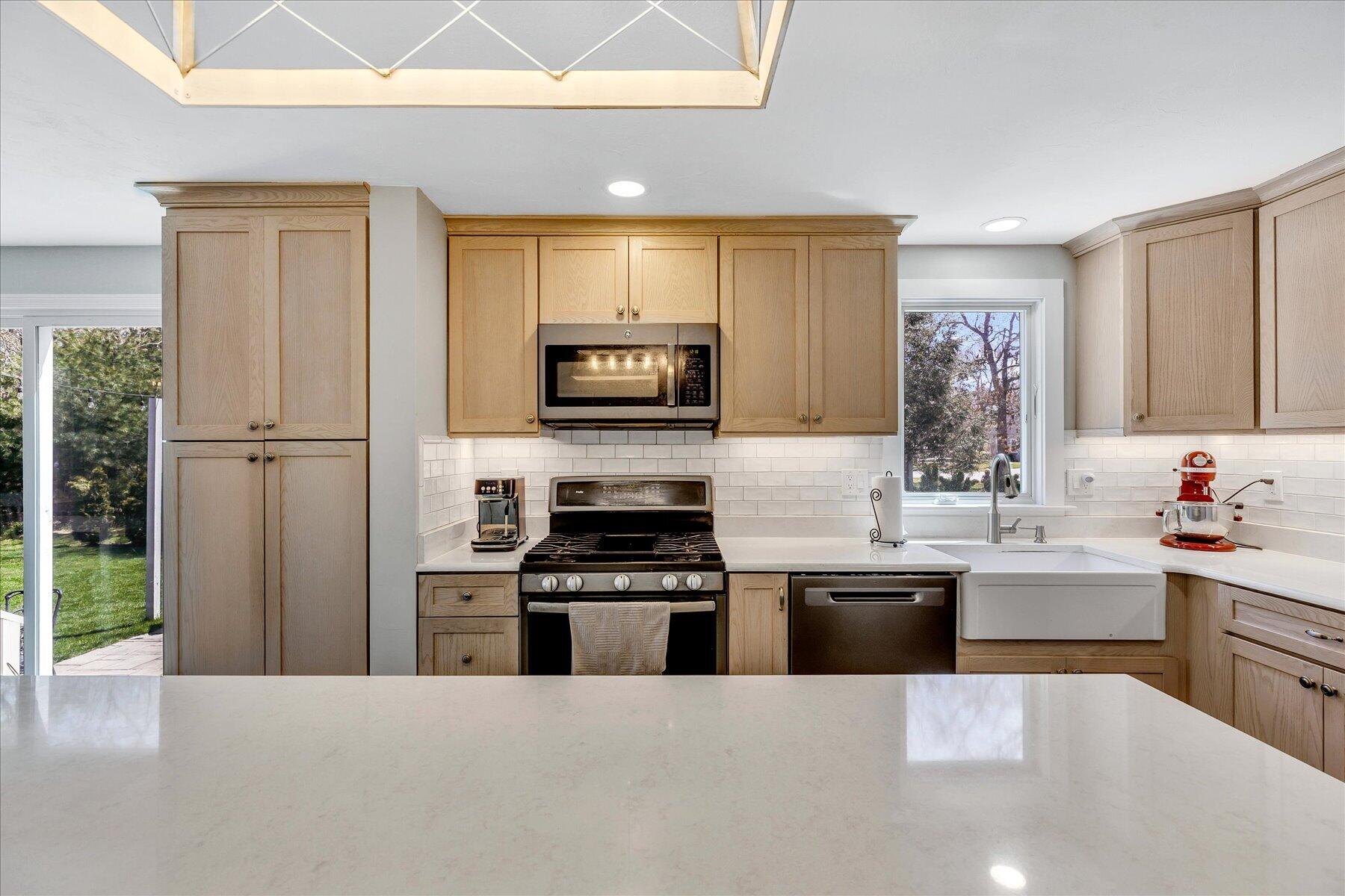 12 Drew Lane Mashpee, MA 02649 - Photo 20 of 49 a large kitchen with stainless steel appliances