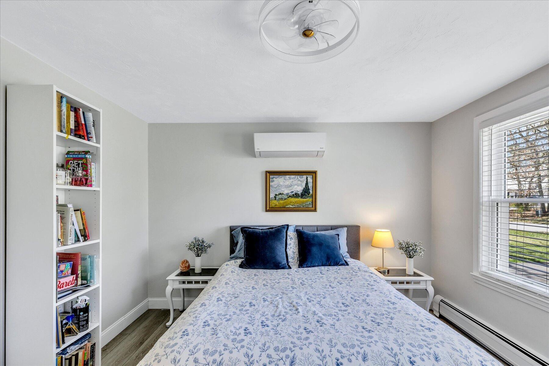 12 Drew Lane Mashpee, MA 02649 - Photo 22 of 49 a bedroom with a bed and a book shelf