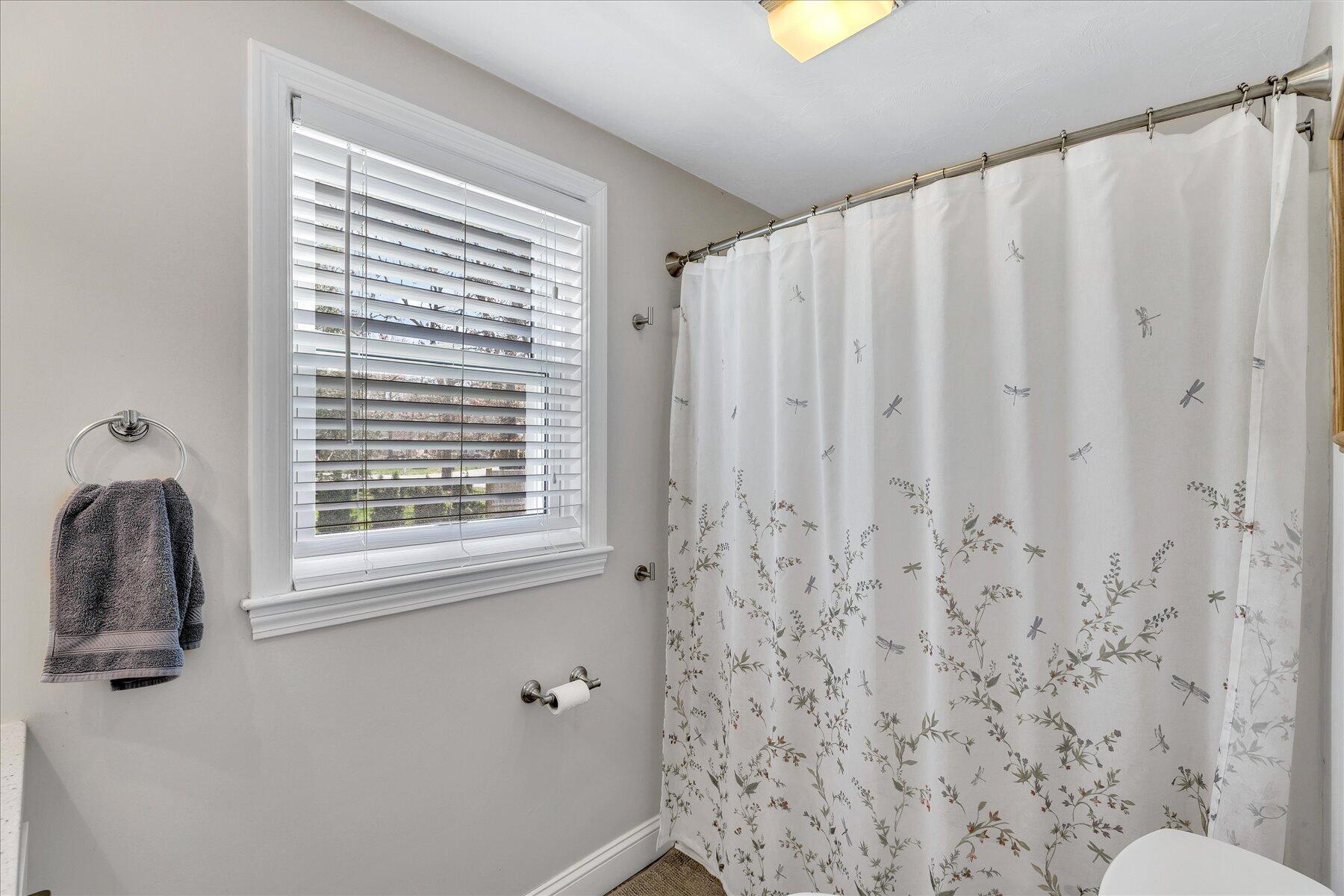 12 Drew Lane Mashpee, MA 02649 - Photo 25 of 49 a bathroom with a toilet and a shower curtain