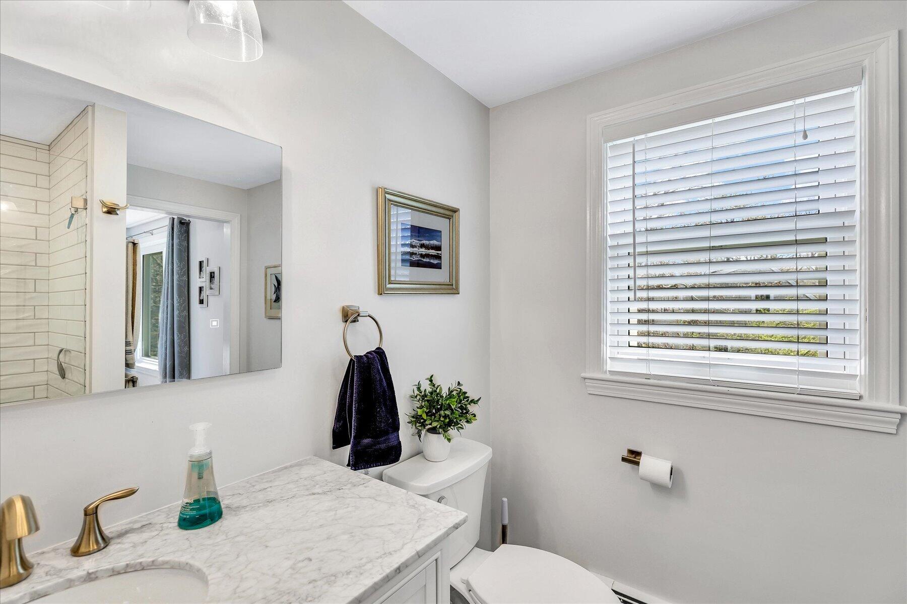 12 Drew Lane Mashpee, MA 02649 - Photo 33 of 49 a bathroom with a granite countertop sink and a mirror