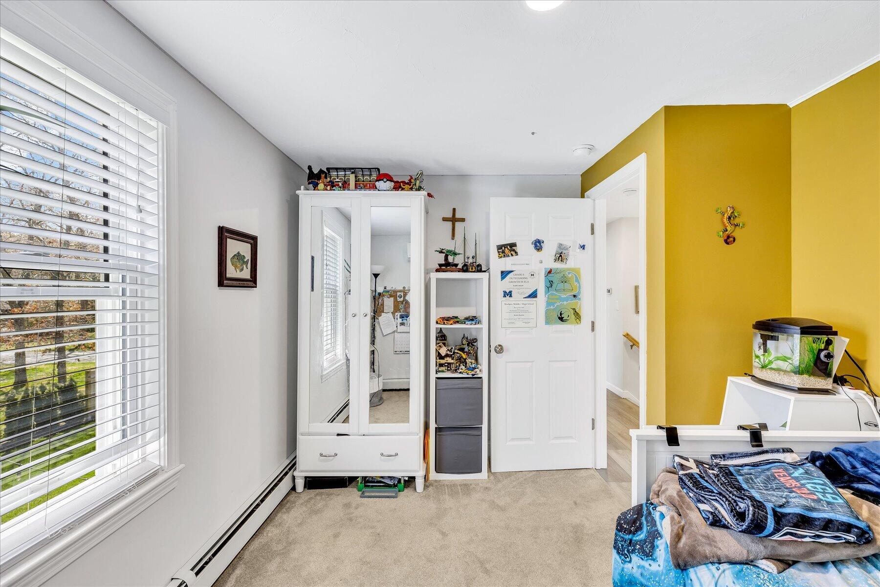 12 Drew Lane Mashpee, MA 02649 - Photo 37 of 49 a bedroom with a bed and a window