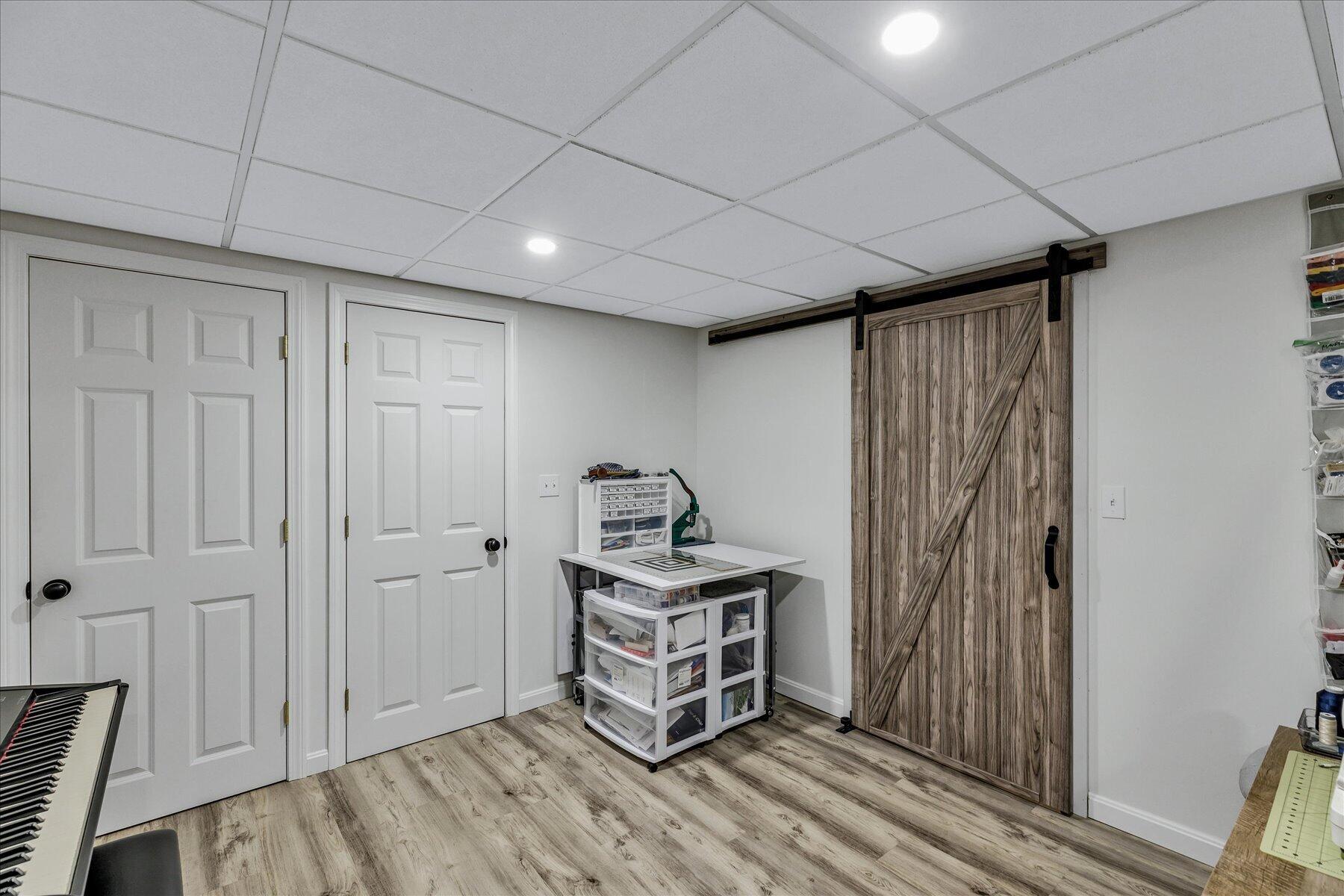12 Drew Lane Mashpee, MA 02649 - Photo 41 of 49 a room with furniture and a chandelier