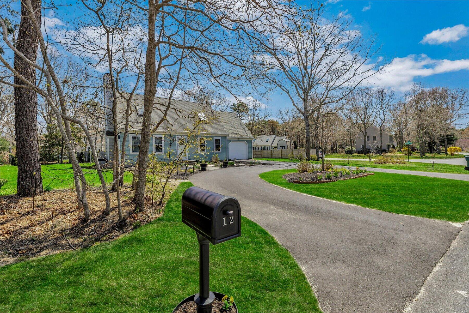 12 Drew Lane Mashpee, MA 02649 - Photo 47 of 49 a street view with large trees