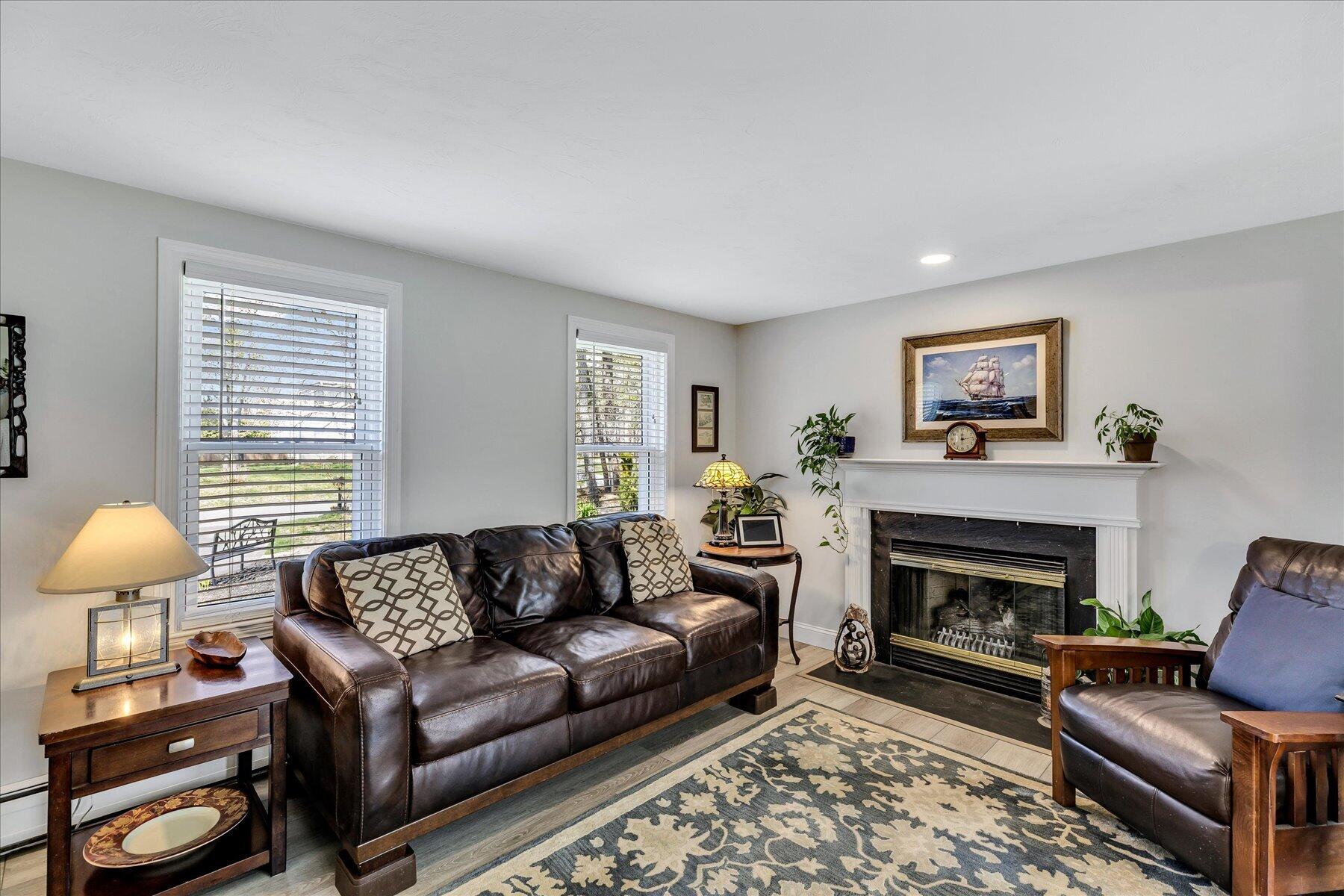 12 Drew Lane Mashpee, MA 02649 - Photo 6 of 49 a living room with furniture and a fireplace