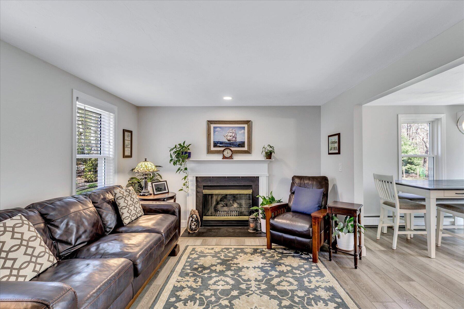 12 Drew Lane Mashpee, MA 02649 - Photo 7 of 49 a living room with furniture and a fireplace