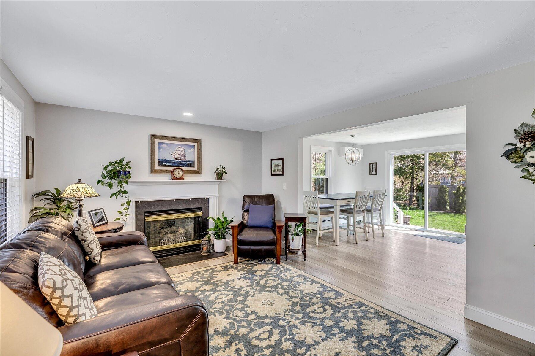 12 Drew Lane Mashpee, MA 02649 - Photo 8 of 49 a living room with furniture and a fireplace