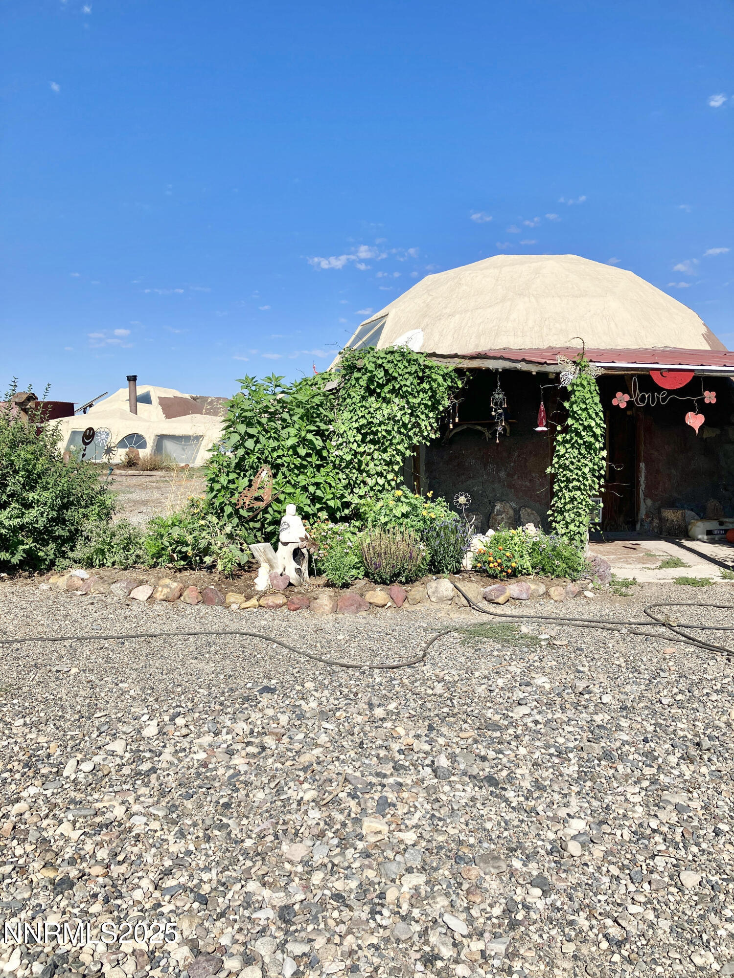 52 Horseshoe Circle Crescent Valley, NV 89821 - Photo 11 of 67 a front view of a house with a yard and garage