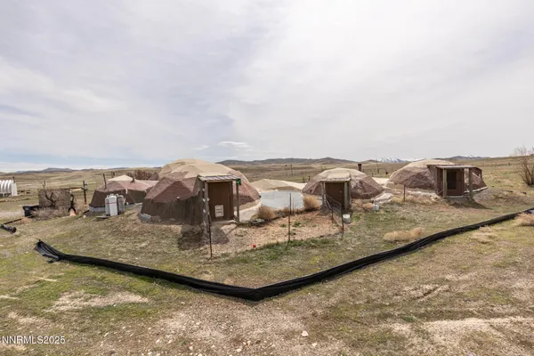 a view of a large body of water with a building in the background