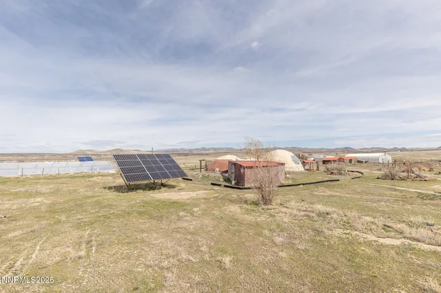 a view of a hallway to a livingroom and a window