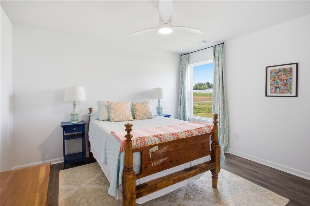 412 Chadwick Lane Walhalla, SC 29691 - Photo 19 of 37 This tranquil bedroom offers a serene retreat with views of the natural landscape.