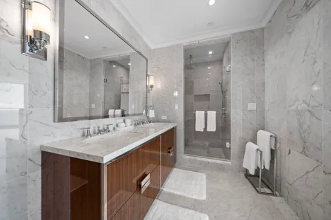 a bathroom with a sink double vanity and a mirror