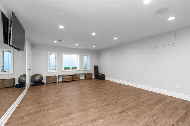 a view of room with furniture and a wooden floor