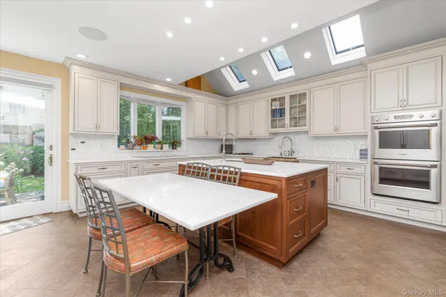 a kitchen with a stove a sink and a refrigerator