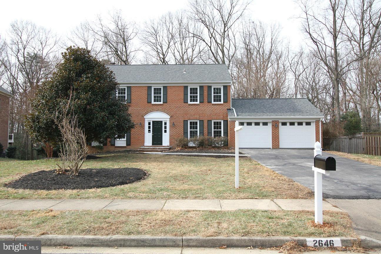 2646 Wild Cherry Place Reston, VA 20191 - Photo 1 of 26 front view of a house with a yard