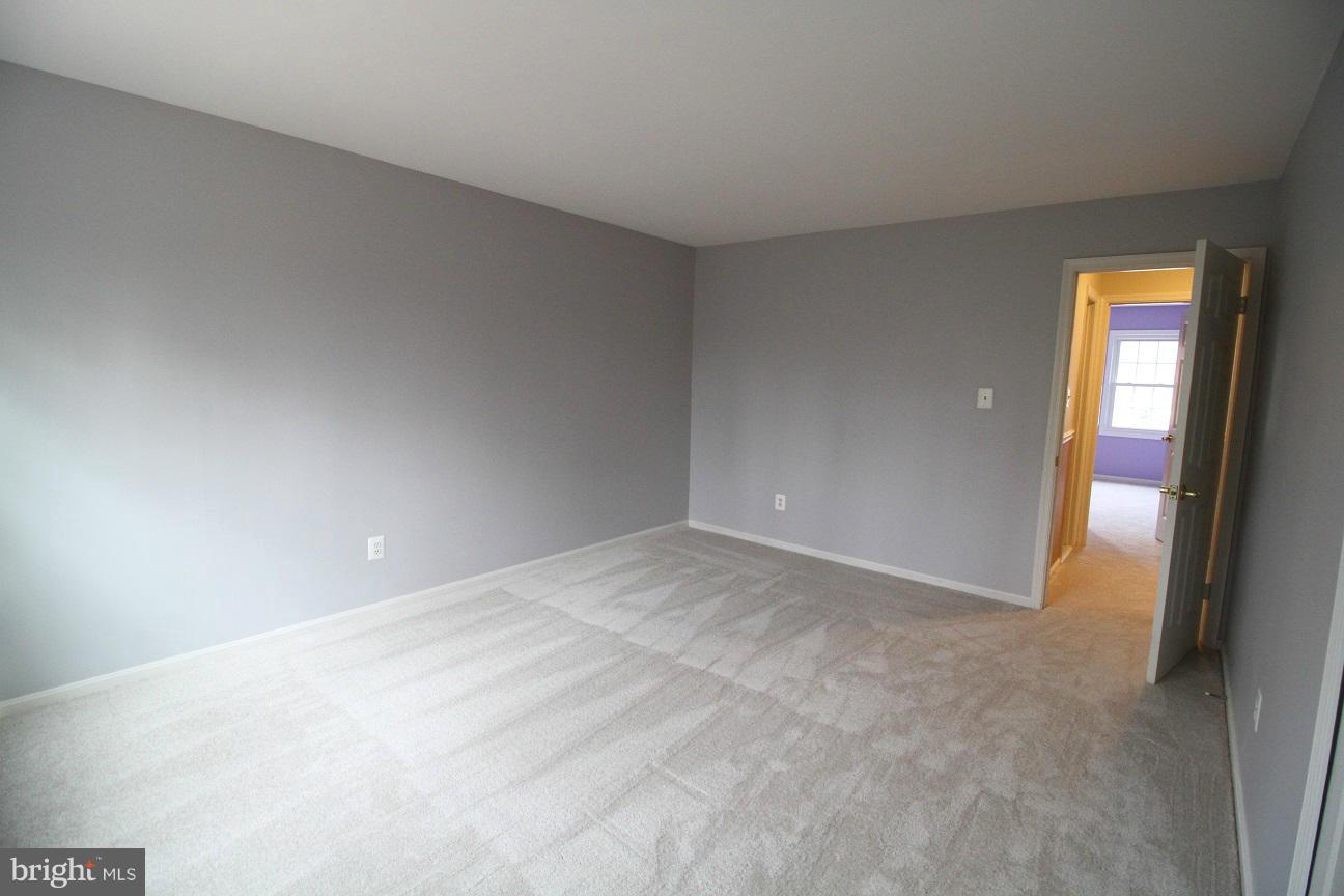 2646 Wild Cherry Place Reston, VA 20191 - Photo 15 of 26 a view of an empty room with a window