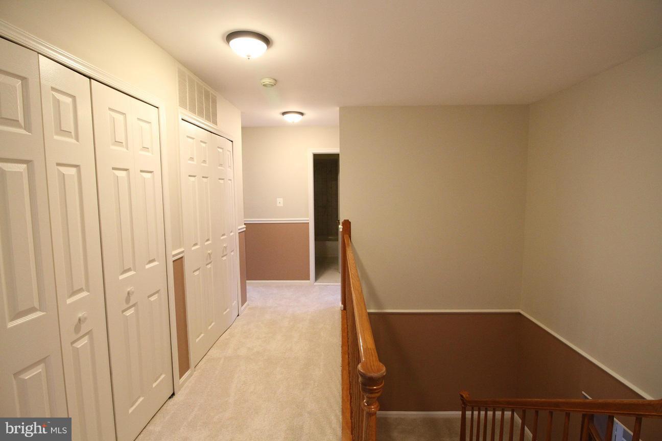 2646 Wild Cherry Place Reston, VA 20191 - Photo 18 of 26 a view of entryway with wooden floor