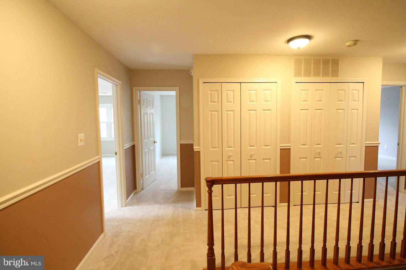 2646 Wild Cherry Place Reston, VA 20191 - Photo 19 of 26 a view of a balcony with wooden floor