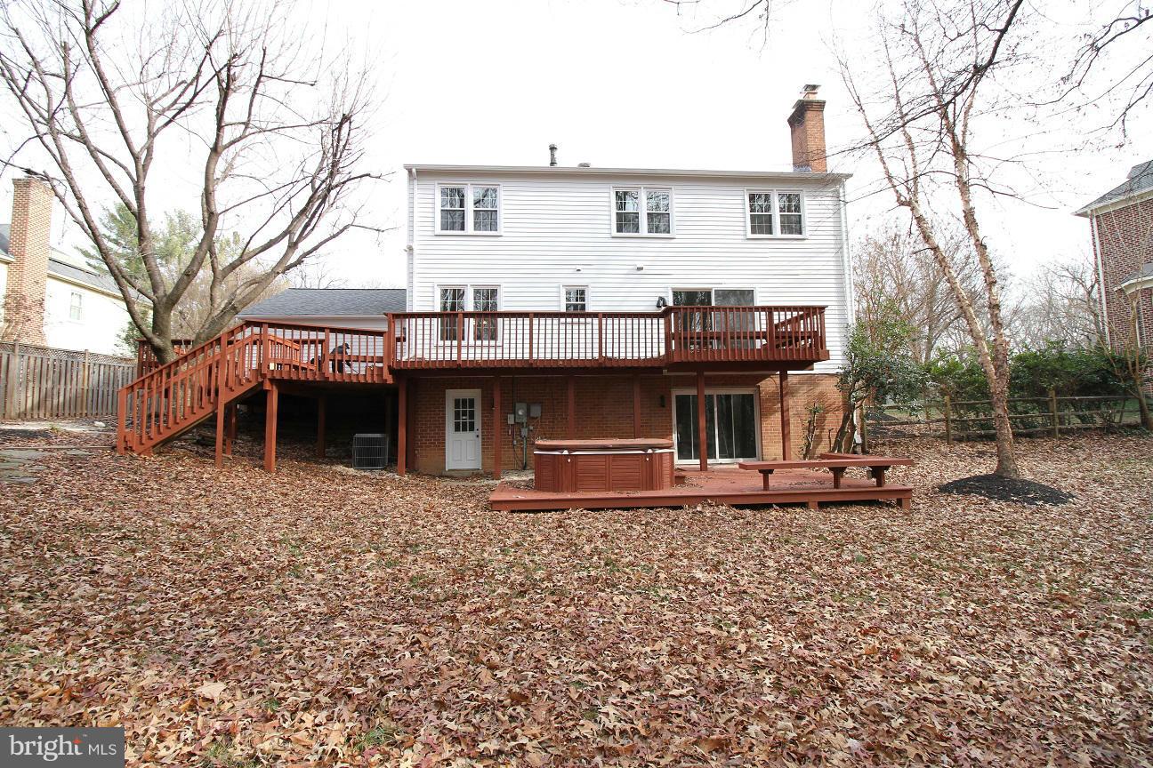 2646 Wild Cherry Place Reston, VA 20191 - Photo 26 of 26 a front view of a house with garden