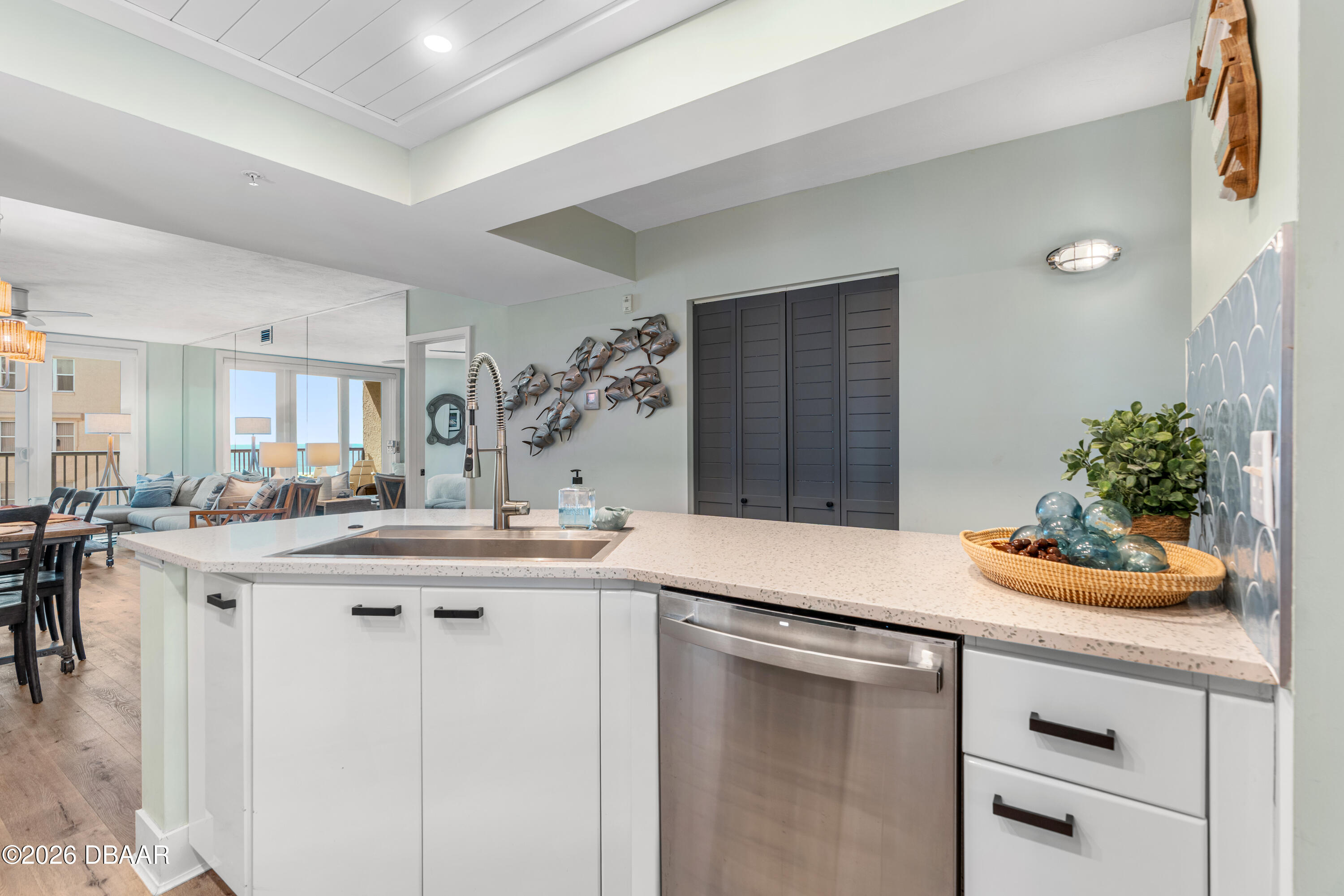 4565 South Atlantic Avenue, Unit 5410 Ponce Inlet, FL 32127 - Photo 21 of 67 a kitchen with a sink and cabinets