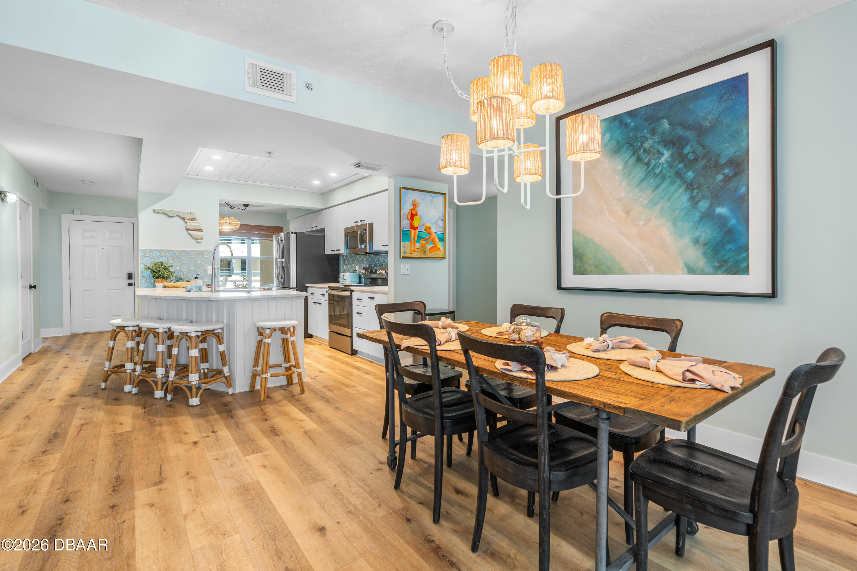 4565 South Atlantic Avenue, Unit 5410 Ponce Inlet, FL 32127 - Photo 29 of 67 a view of a dining room with furniture and wooden floor
