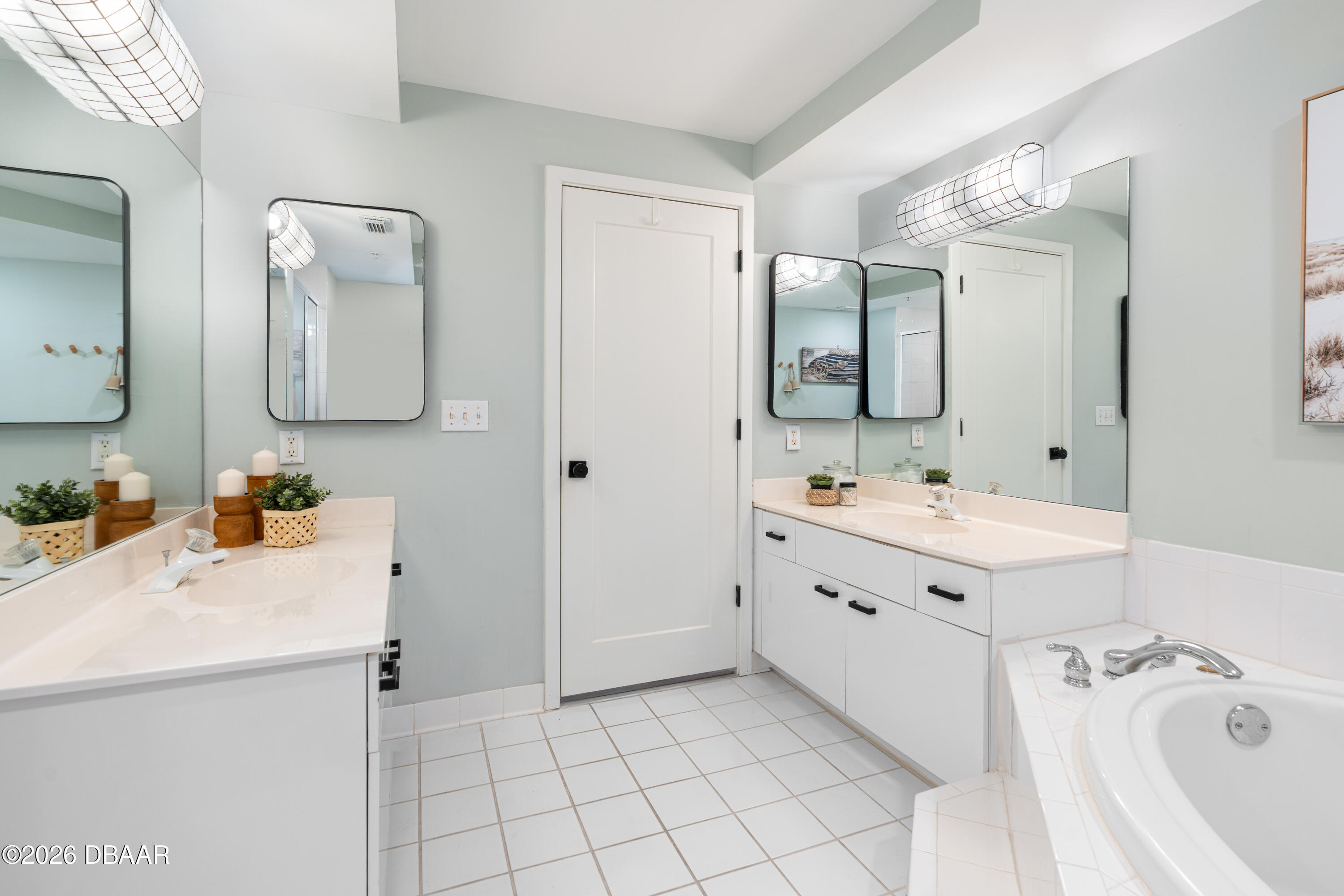 4565 South Atlantic Avenue, Unit 5410 Ponce Inlet, FL 32127 - Photo 39 of 67 a spacious bathroom with a double vanity sink mirror and