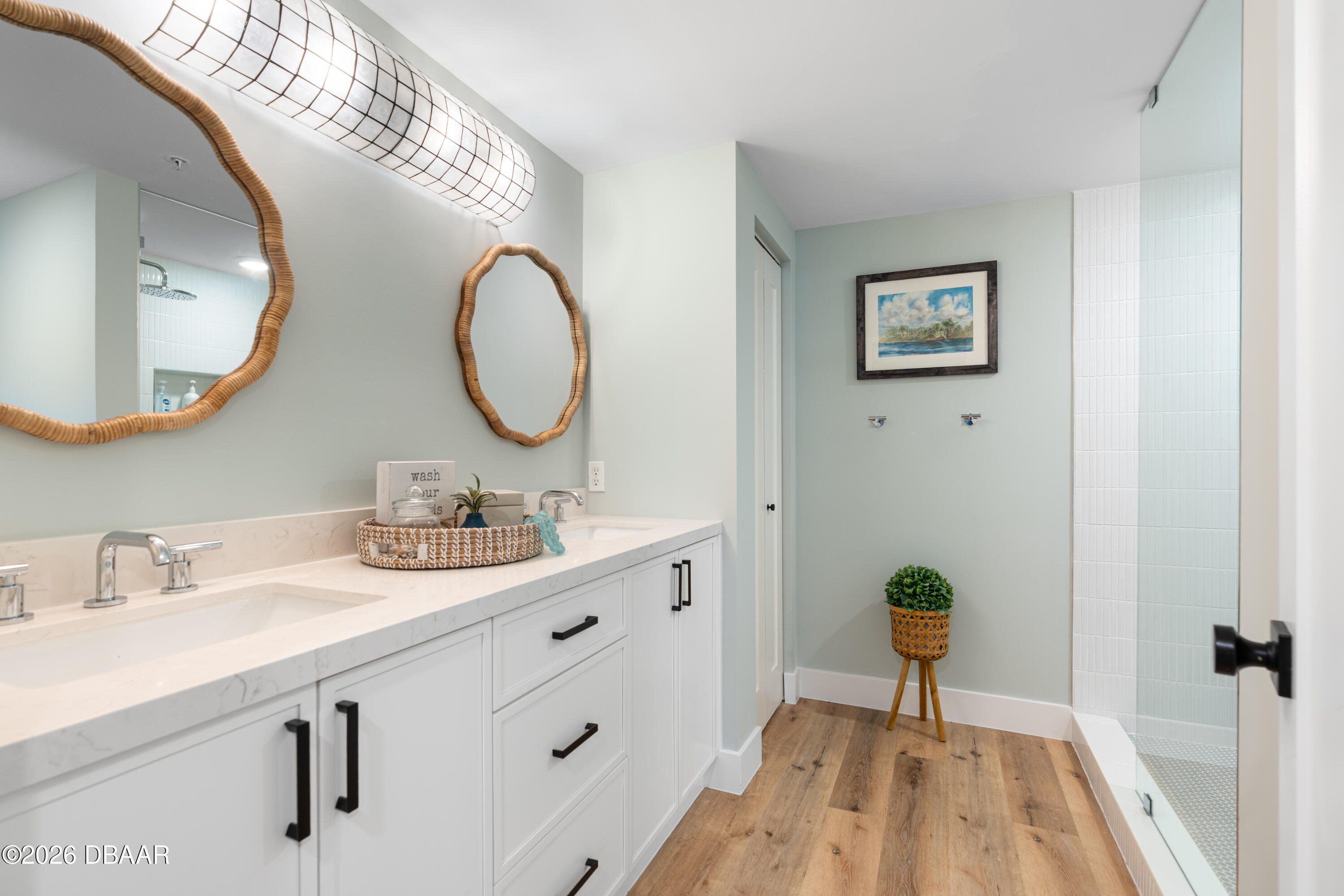 4565 South Atlantic Avenue, Unit 5410 Ponce Inlet, FL 32127 - Photo 43 of 67 a bathroom with a sink and a mirror