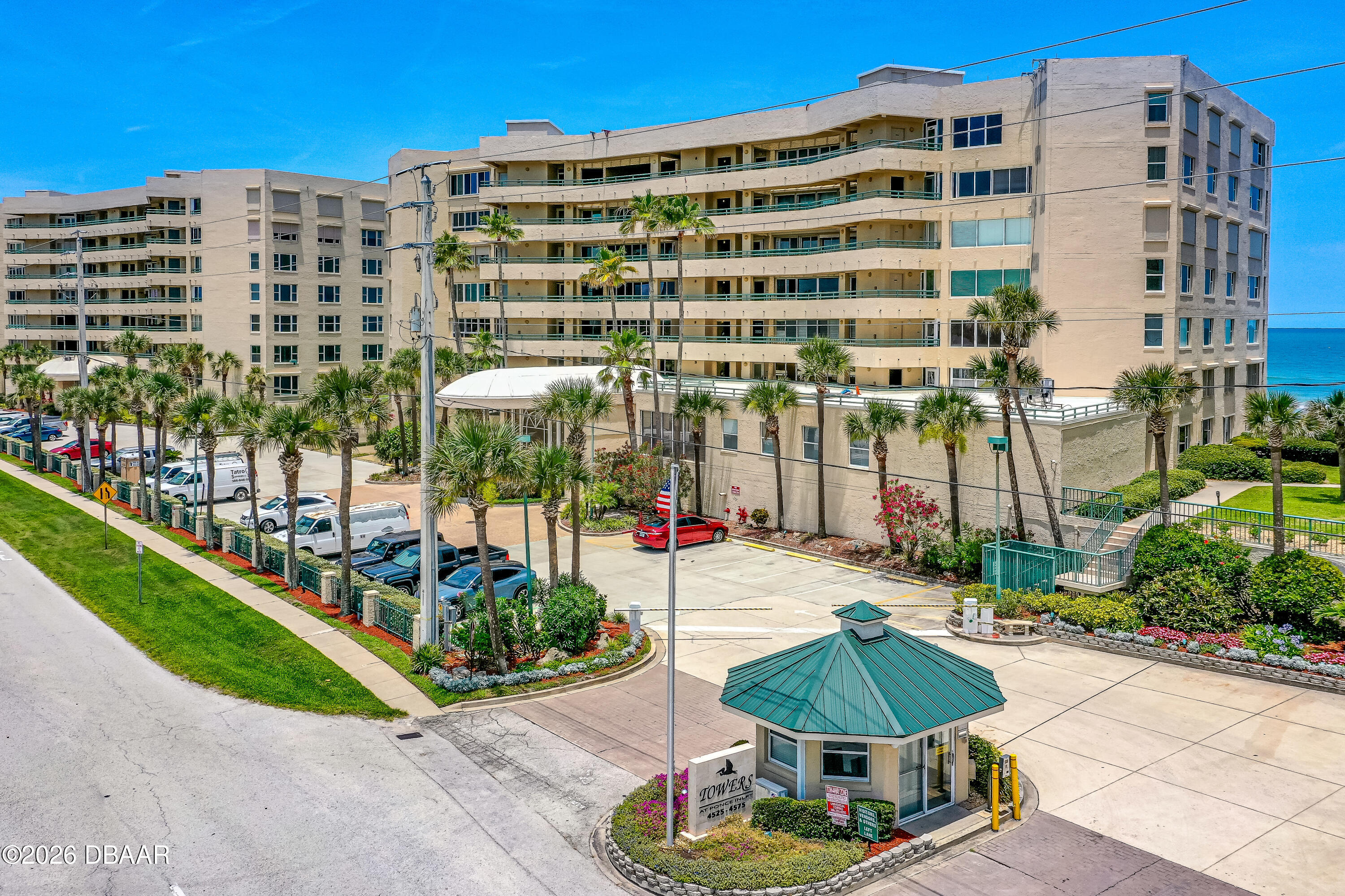 4565 South Atlantic Avenue, Unit 5410 Ponce Inlet, FL 32127 - Photo 51 of 67 a view of a tall building and a yard