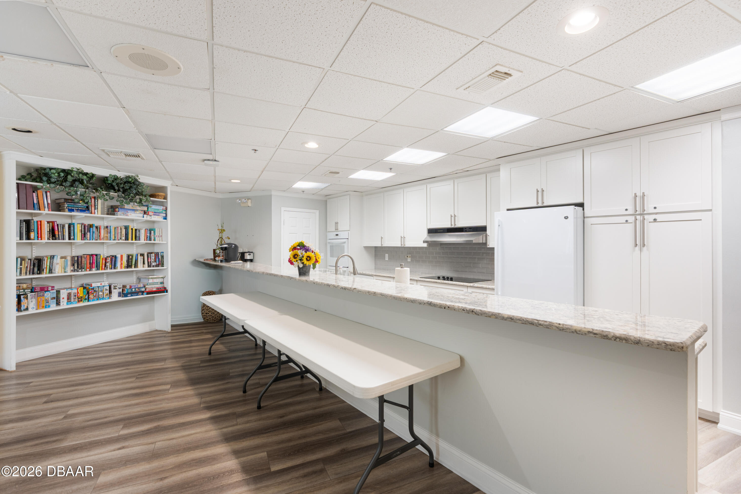 4565 South Atlantic Avenue, Unit 5410 Ponce Inlet, FL 32127 - Photo 59 of 67 a large kitchen with lots of counter space and wooden floor