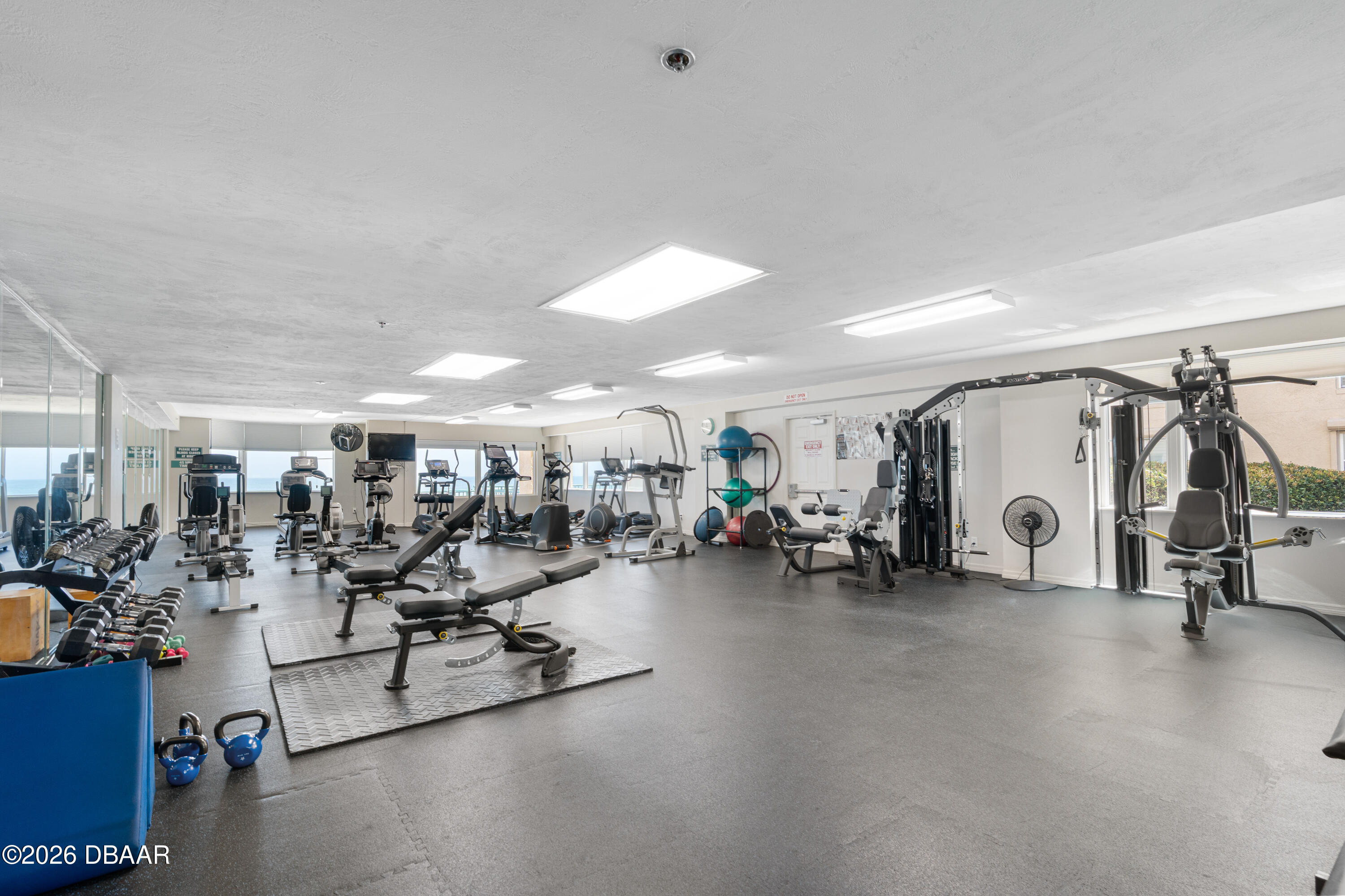 4565 South Atlantic Avenue, Unit 5410 Ponce Inlet, FL 32127 - Photo 61 of 67 a view of a room with gym equipment and a large window