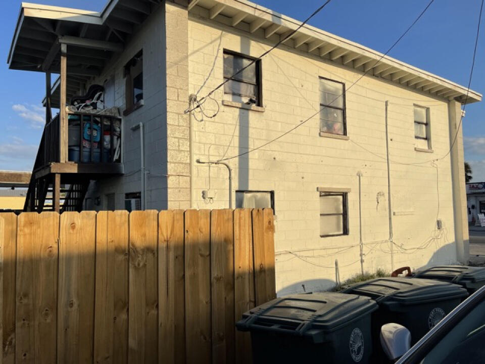 1706 Ave D Fort Pierce, FL 34950 - Photo 3 of 4 a bathroom with a granite countertop sink and a shower